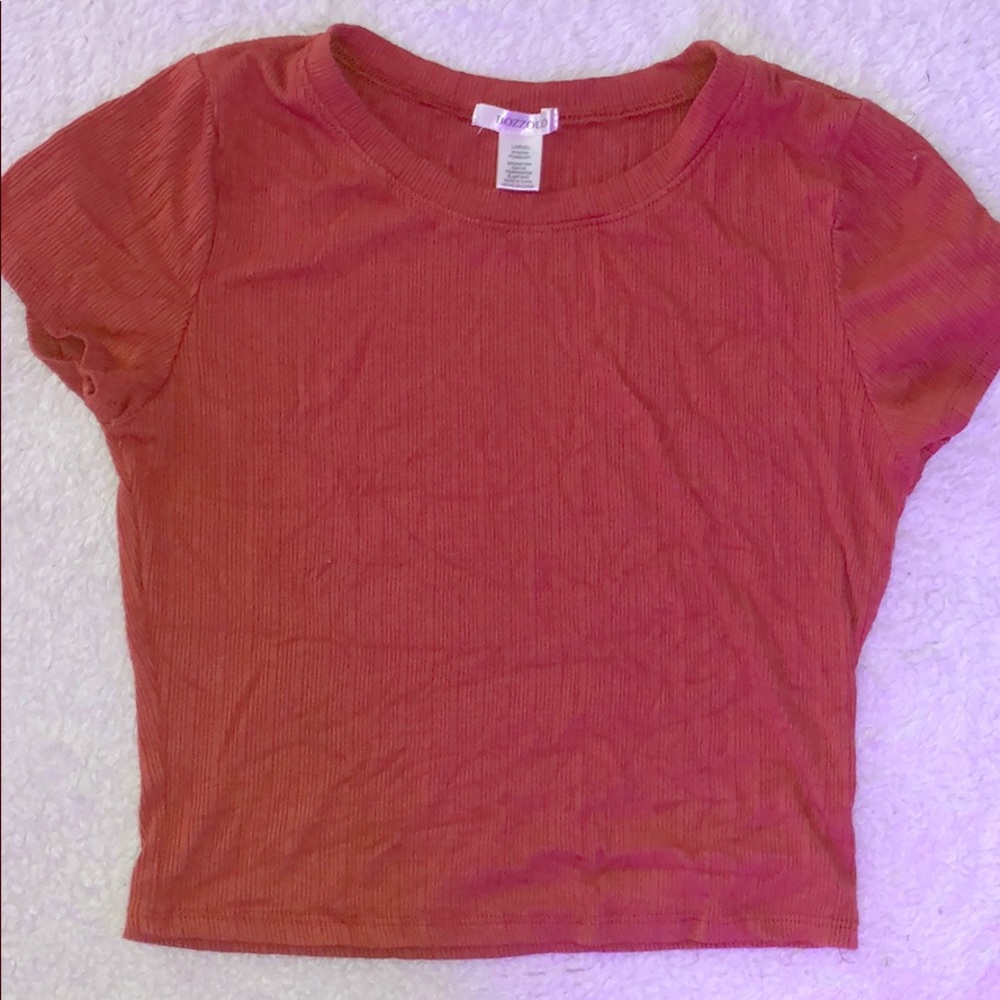 an orange colored crop top